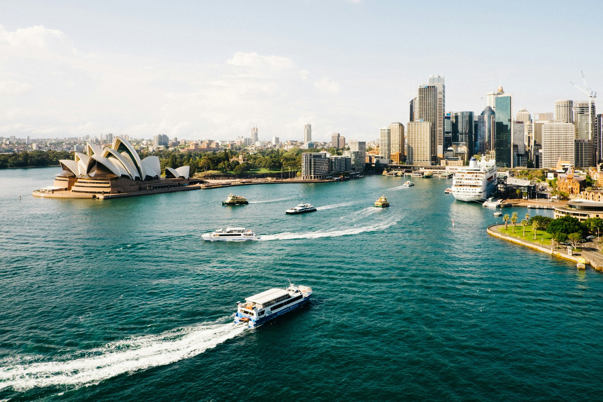 Sydney Harbour aerial view with Opera House, ferries, and city skyline - Dundee Adventure Travel